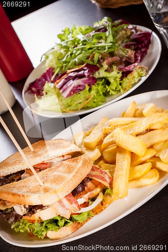 Image of Club sandwich with potato French fries