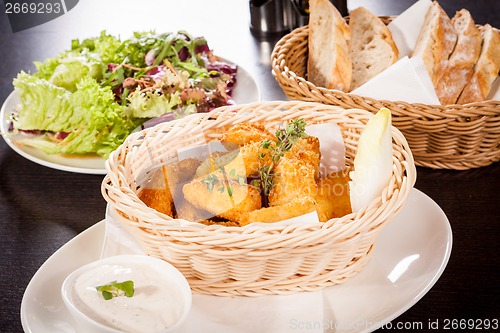 Image of Crumbed chicken nuggets in a basket