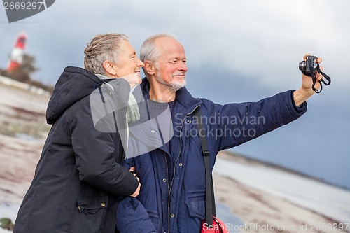 Image of Elderly couple taking a self portrait