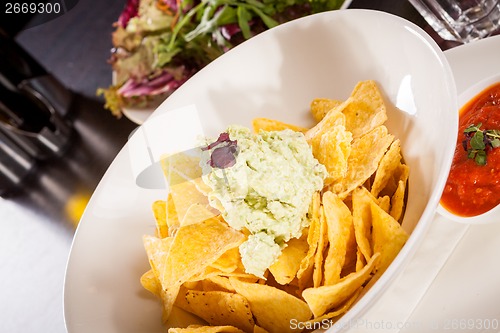 Image of Crisp corn nachos with guacamole sauce