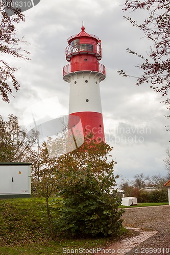 Image of landscape baltic sea dunes lighthouse in red and white 