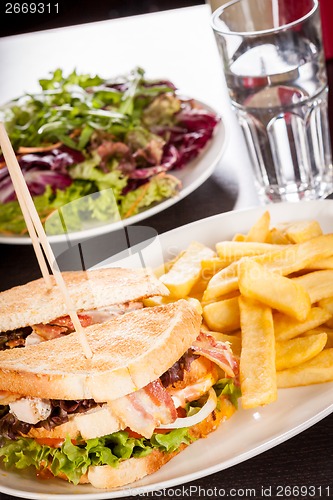 Image of Club sandwich with potato French fries