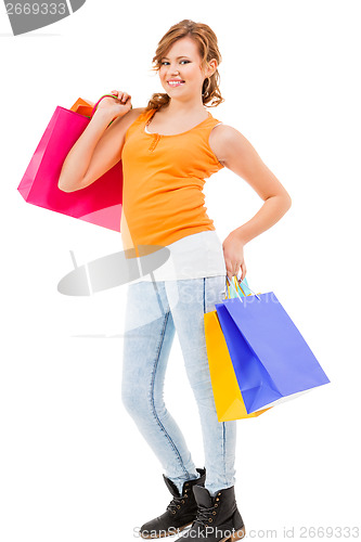 Image of attractive young woman with colorful shopping bags