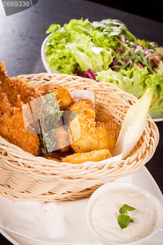 Image of Crisp crunchy golden chicken legs and wings