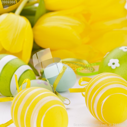 Image of Colourful yellow and green spring Easter Eggs