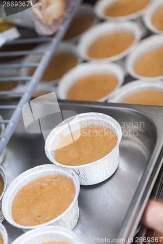 Image of Chef preparing desserts removing them from moulds