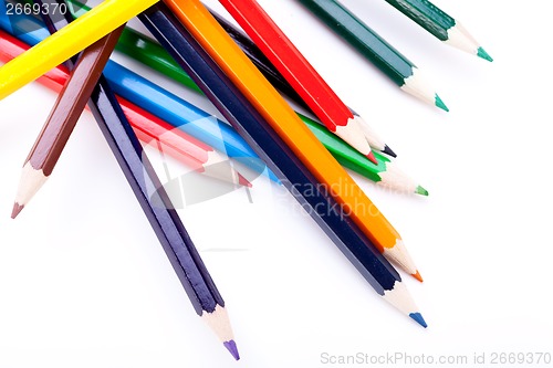 Image of Bunch of colourful pencil crayons on white