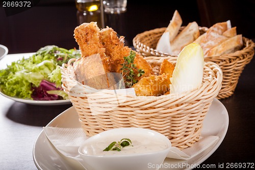 Image of Crisp crunchy golden chicken legs and wings