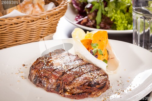 Image of Grilled beef steak with seasoning