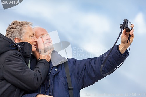 Image of Elderly couple taking a self portrait