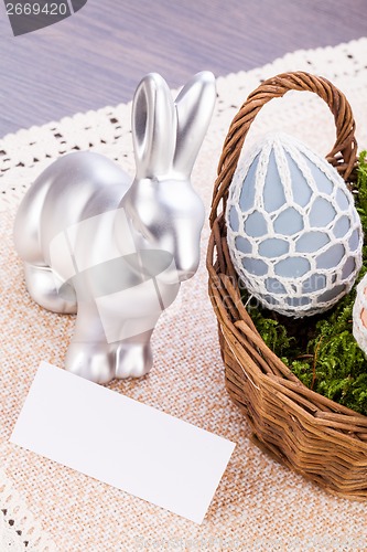 Image of Easter still life with a silver bunny and eggs