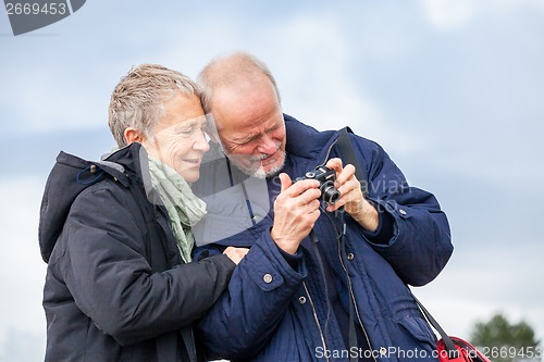 Image of Elderly couple taking a self portrait