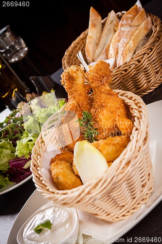 Image of Crisp crunchy golden chicken legs and wings