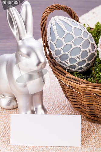 Image of Easter still life with a silver bunny and eggs