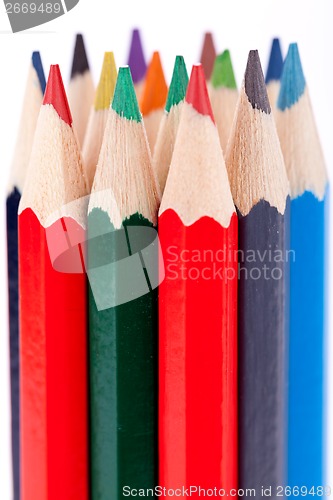 Image of Bunch of colourful pencil crayons on white