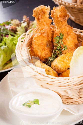 Image of Crisp crunchy golden chicken legs and wings