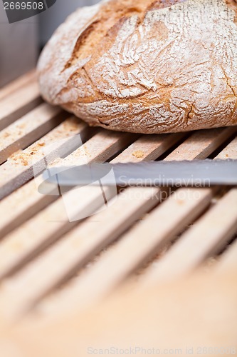 Image of homemade fresh baked bread and knife 