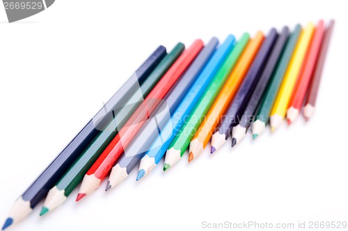 Image of Bunch of colourful pencil crayons on white