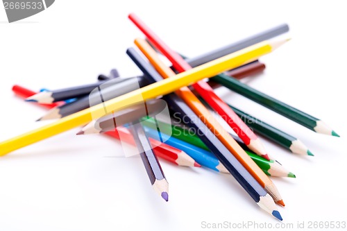 Image of Bunch of colourful pencil crayons on white