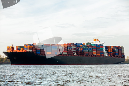 Image of Fully laden container ship in port