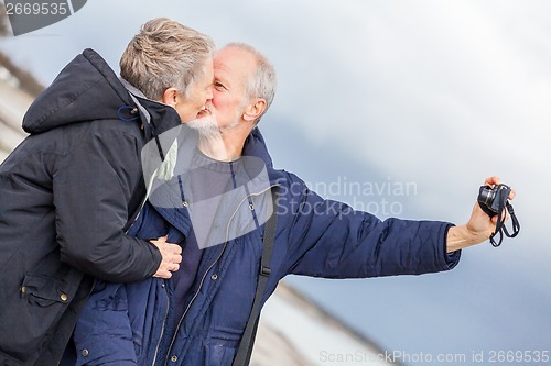 Image of Elderly couple taking a self portrait