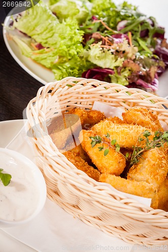 Image of Crumbed chicken nuggets in a basket