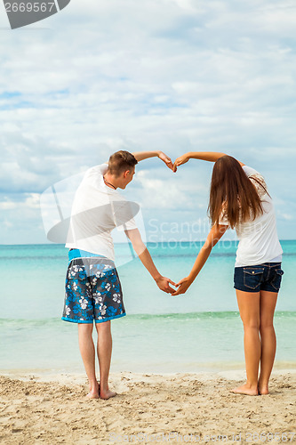 Image of smiling young couple having fun in summer holiday