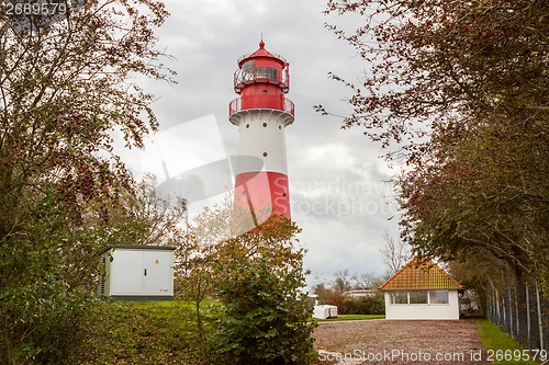 Image of landscape baltic sea dunes lighthouse in red and white 