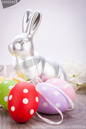 Image of Easter still life with a silver bunny and eggs