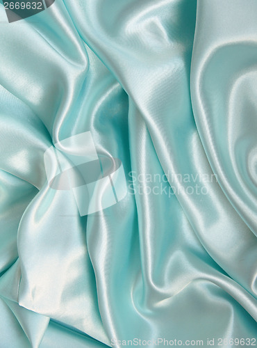 Image of Smooth elegant blue silk as background 