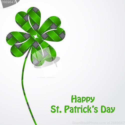 Image of St Patrick's shamrock on green texture and white backdrop