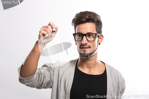 Image of Young man writing on a glass