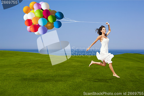 Image of Jumping with a colored ballons
