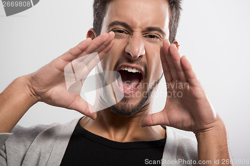 Image of Young man shouting