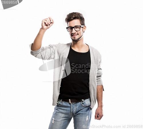 Image of Young man writing on a glass