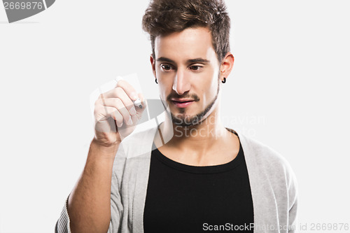 Image of Young man writing on a glass