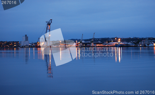 Image of Still water at the harbour lat at night