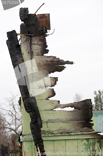 Image of burnt wooden wall ruin