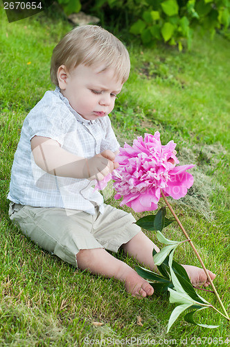 Image of Baby boy with pink peony