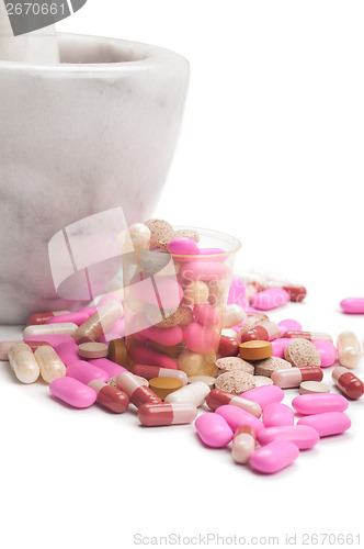 Image of Pink pills and marble mortar