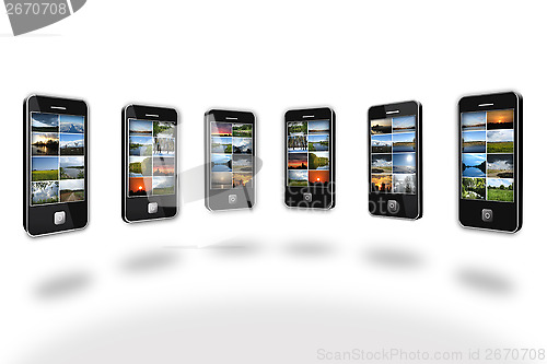 Image of Modern mobile phones with different images