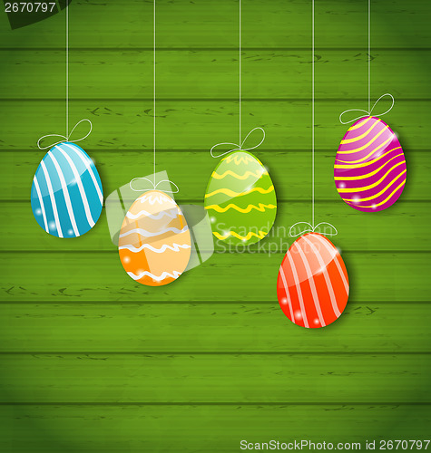 Image of Easter colorful eggs on wooden texture