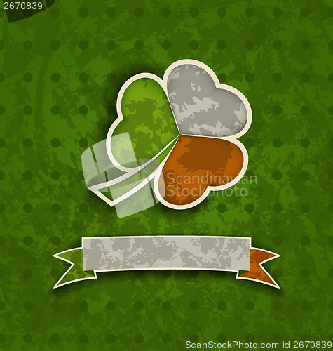 Image of Holiday vintage background with clover and ribbon in Irish flag 