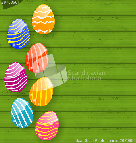 Image of Easter colorful eggs on wooden texture