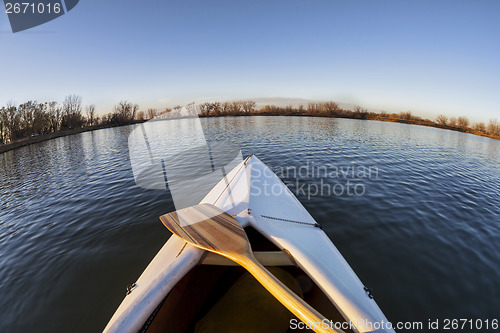 Image of canoe bow and paddle 