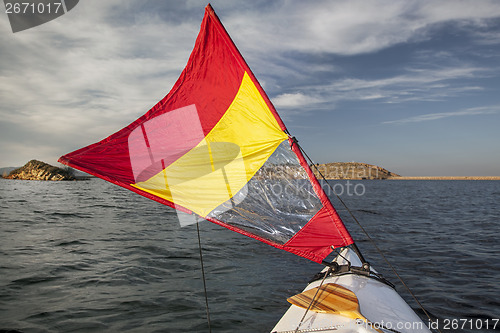 Image of sailing canoe on a lake