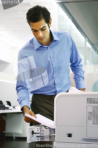 Image of worker using a copy machine