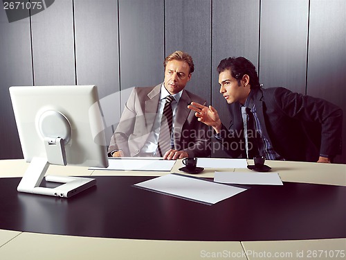 Image of businesspeople at computer