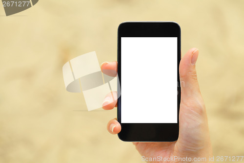 Image of Blank screen on mobile with hand holding