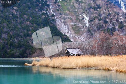 Image of Beautiful lake with wooden house 